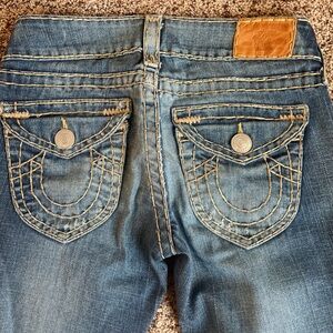 Vintage pair of low rise True Religion women’s jeans.